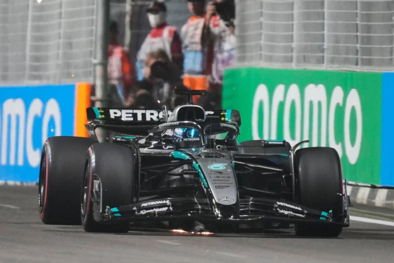 George Russell wins F1’s Singapore GP as McLaren secures constructors’ title