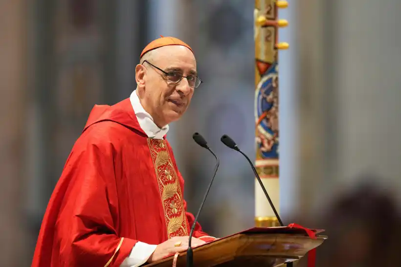 Cardinal Victor Manuel Fernandez delivers his speech during a mass on the sixth of nine days of mourning for late Pope Francis, in St. Peter’s Basilica at the Vatican