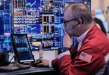 After a day of sharp swings, Wall Street ends nearly where it began