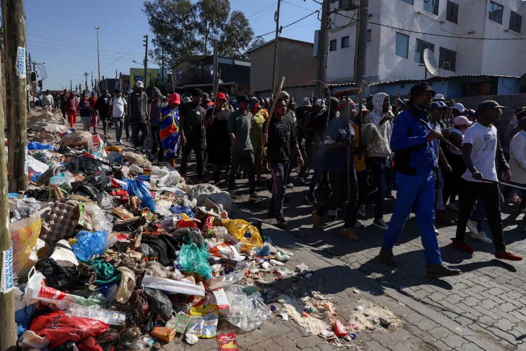 South African protesters go door-to-door forcing immigrants from their homes South African protesters go door-to-door forcing immigrants from their homes